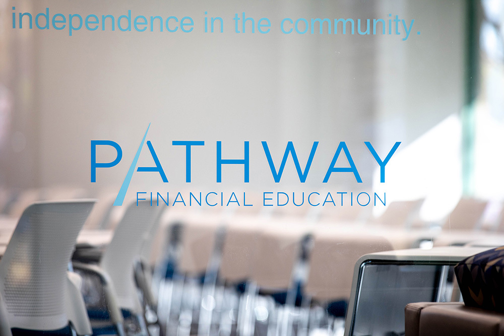 Pathway Financial Education sign on glass