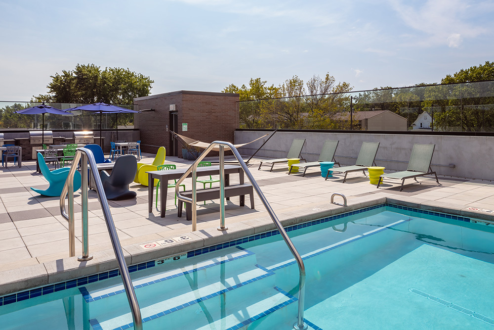 amenity lounge patio pool of The Union on Lincoln Way Student Living