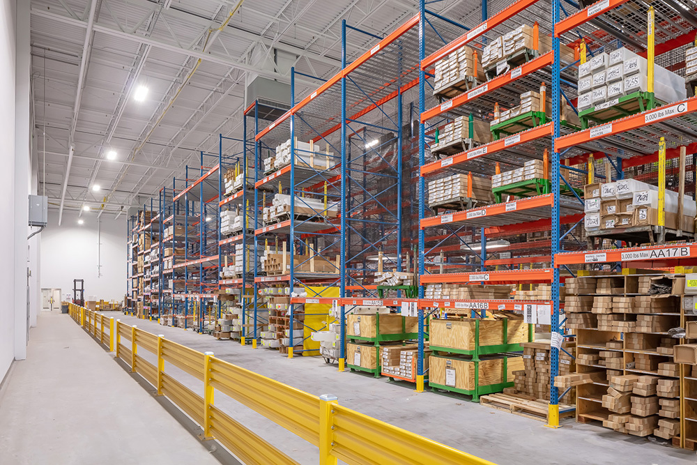 warehouse in an industrial building with tall shelves filled with items