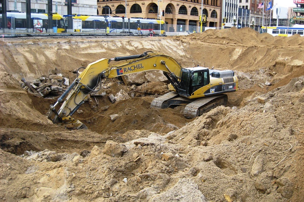 heavy equipment excavating on construction site
