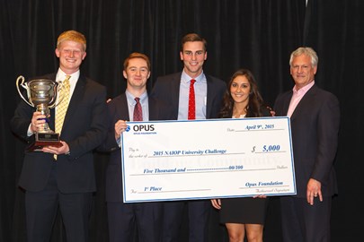group of men and women holding trophy and large check for $5,000 to the 2015 NAIOP University Challenge from the Opus Foundation