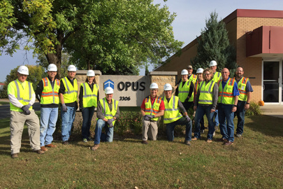 The Opus Group Executive Leadership Team outside of the Eagan facility