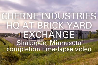 words, "Cherne Industries HQ at Brick Yard Exchange, Shakopee, Minnesota, Completion Time-Lapse Video" in foreground and exterior of industrial building in background