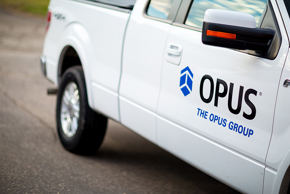 The Opus Group logo on truck