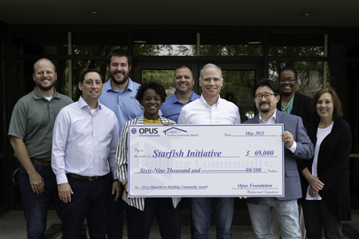 Group of people with giant check at Indianapolis' Starfish Initiative