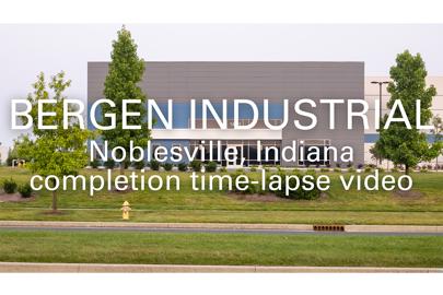 words "Bergen Industrial, Noblesville, Indiana, completion time-lapse video in foreground and industrial building in background