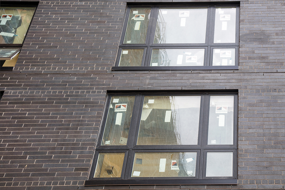 detailed view of exterior of windows in apartment building under construction