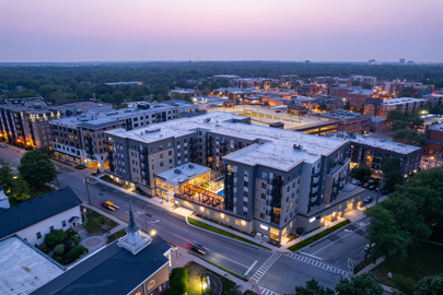 aerial view of the front of residential building at sunset