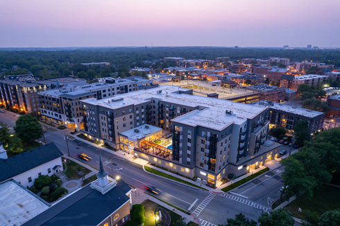 aerial view of the front of residential building at sunset
