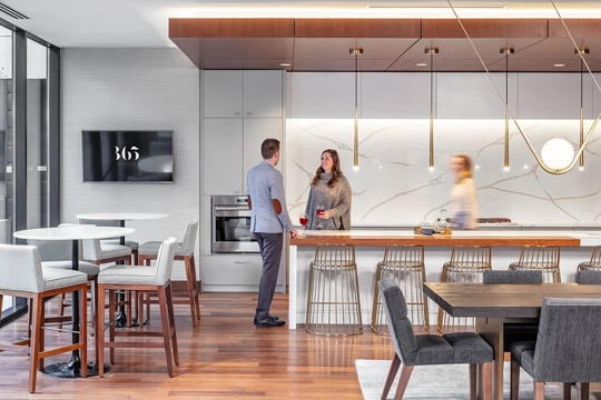 residents of 365 Nicollet gather in the luxury building’s well-designed club room