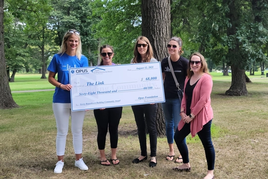 check presentation to The Link, the winner of the 2021 Building Community Award