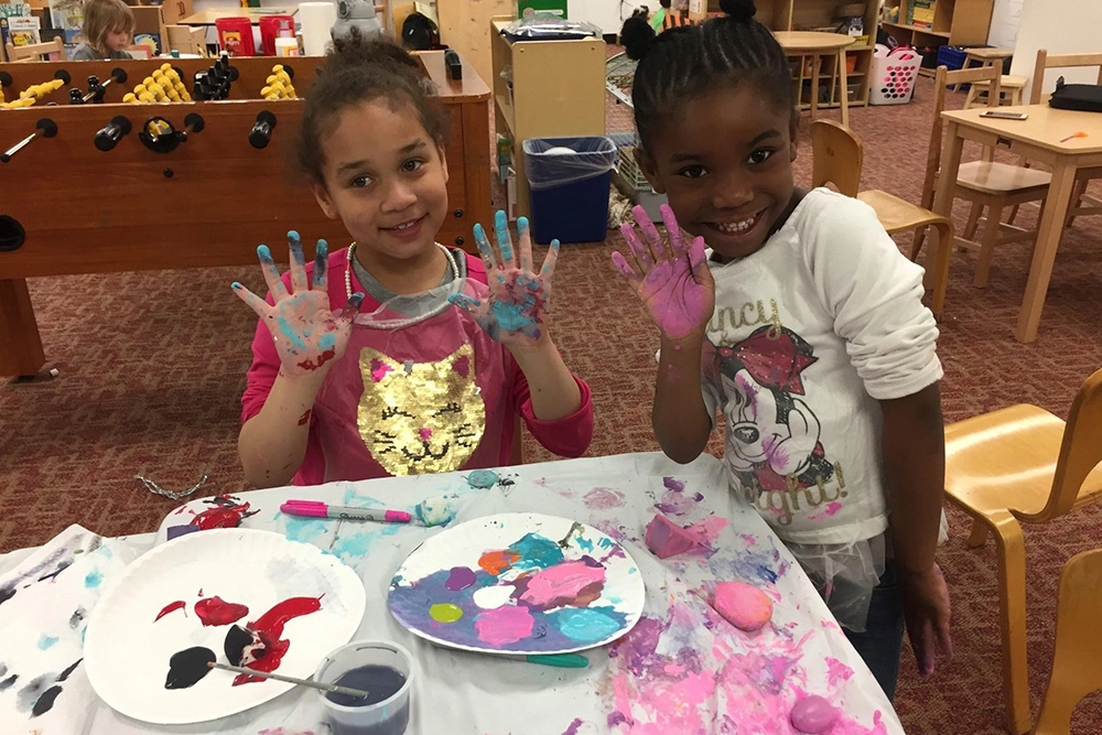 two girls with paint