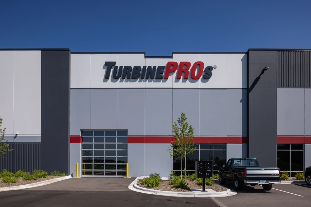 exterior of industrial building with sign reading "TurbinePROs"
