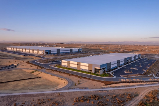 aerial view of industrial buildings at sunset