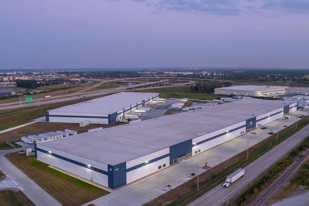 aerial view of industrial building at sunset