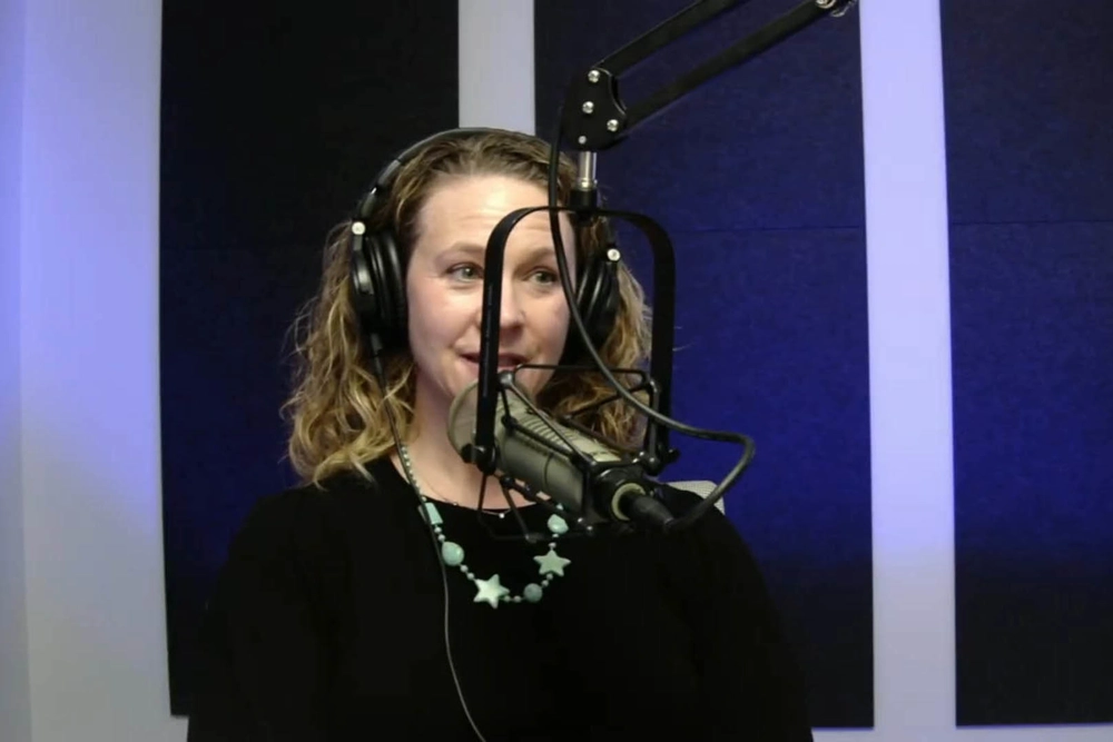 person speaking into microphone