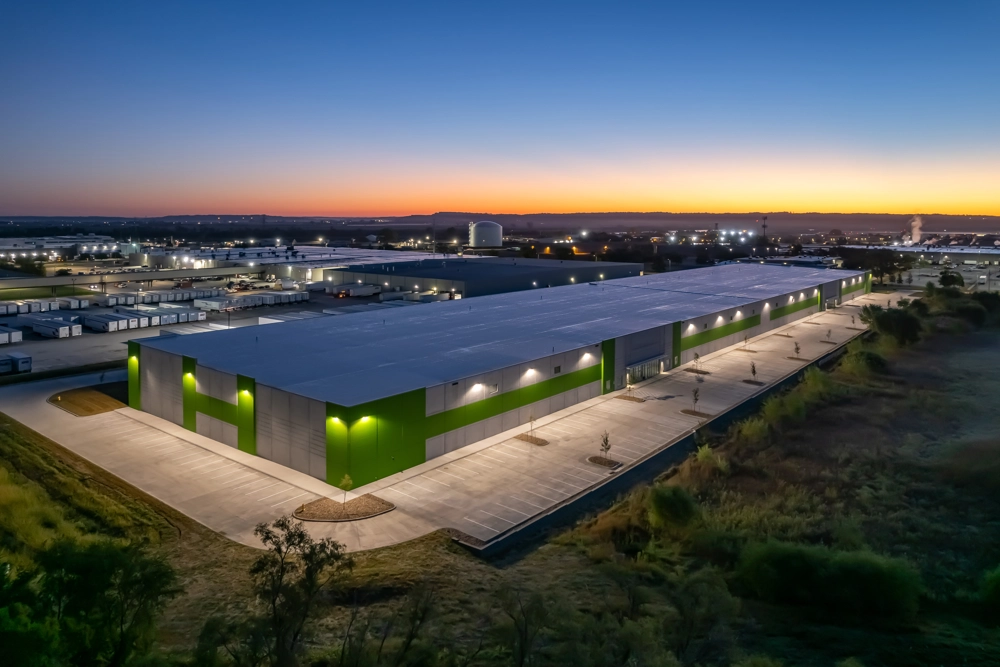 aerial view of an industrial building at sunset