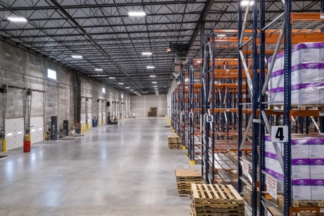 rows of shelving in warehouse of industrial building