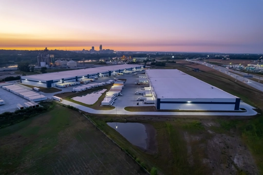 aerial view of industrial building at sunset