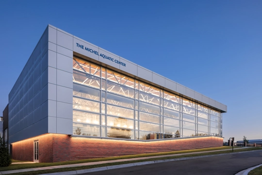 exterior of aquatic center at sunset