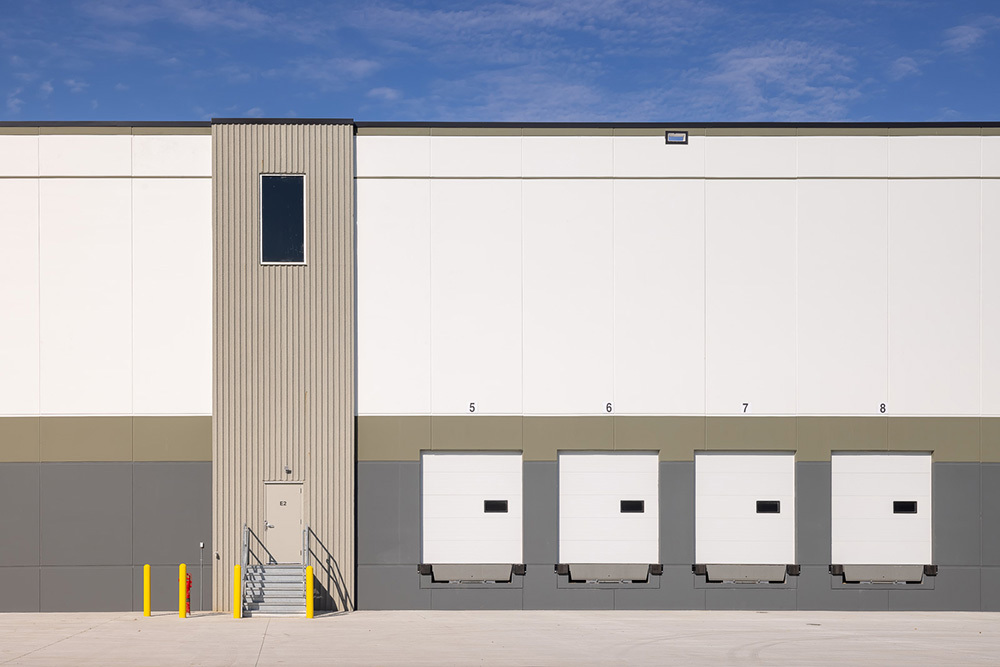 4 rear dock doors for trucks to access on a speculative industrial building and an entrance for people