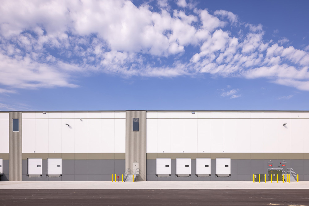 Rear dock doors for trucks to access on a speculative industrial building and an entrance for people