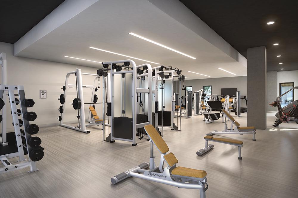 rendering of fitness center in an apartment building showing weightlifting equipment