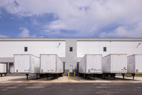 Dock doors with trailers on the back side of an industrial building