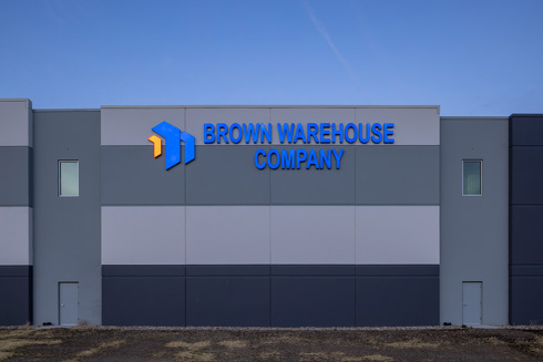 Brown Warehouse Company sign on the exterior of an industrial building