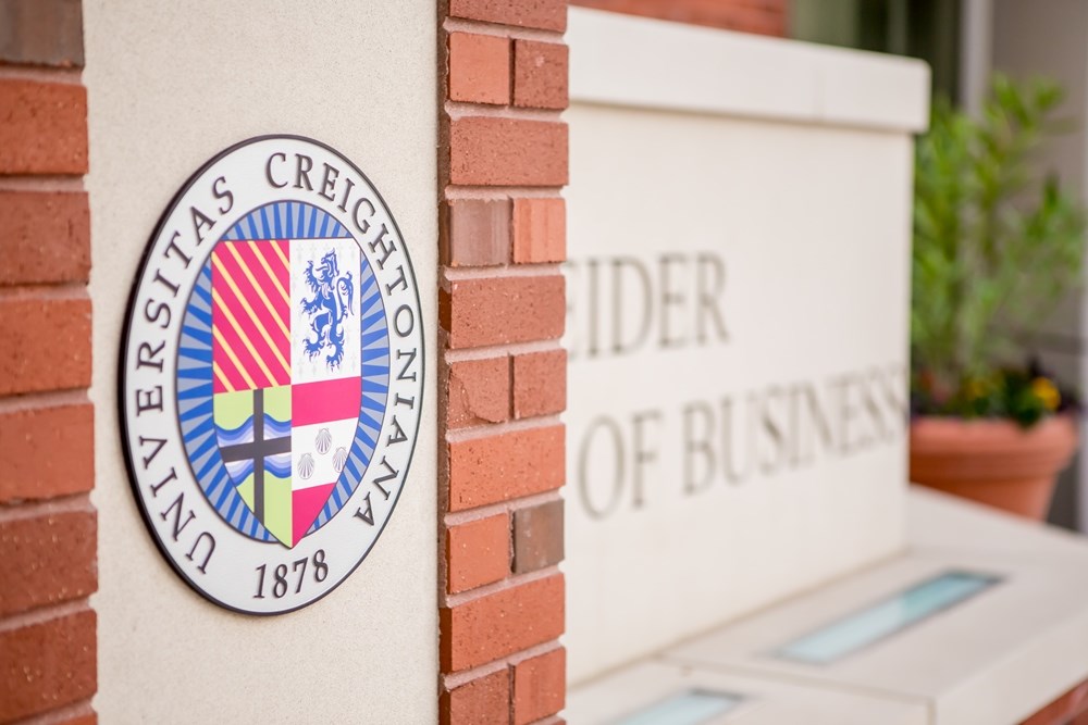 detailed view of Creighton University seal on sign