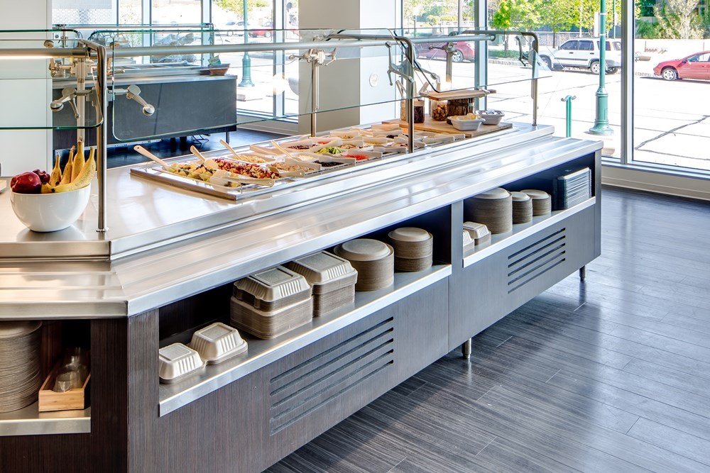 buffet with food in the cafeteria of an office building