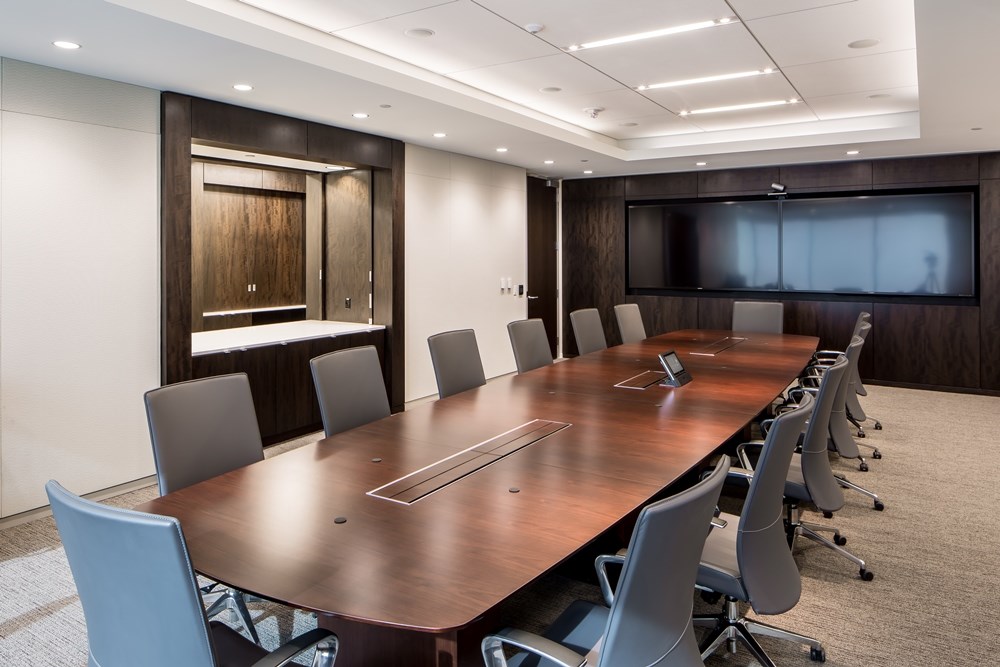 conference room in an office building with long table with 14 chairs