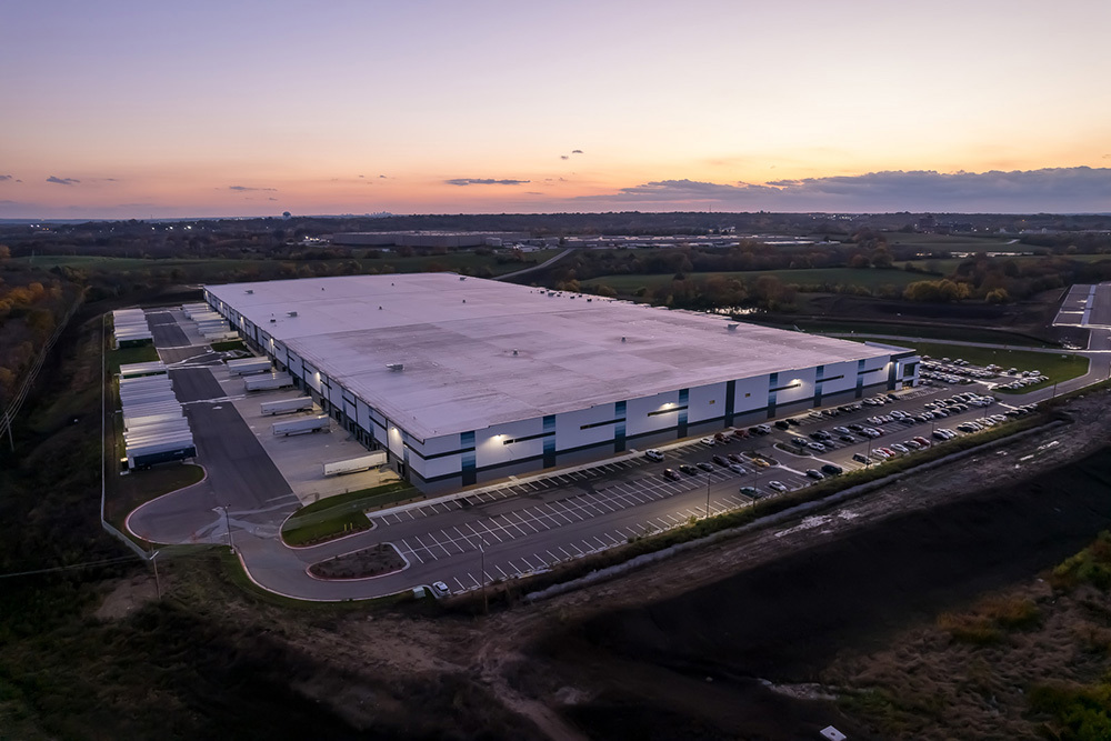 aerial view of industrial building at sunset