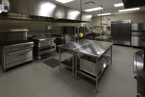 The catering kitchen at Iowa Army National Guard AFRC Complex includes top-of-the-line commercial appliances and prep spaces.