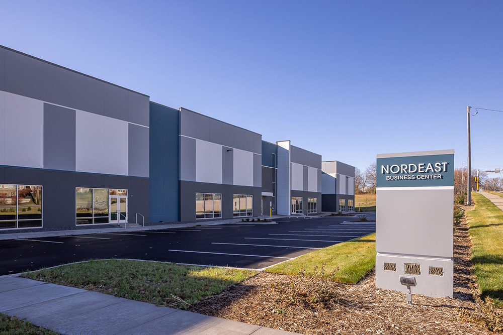Front view of an industrial building showing a Nordeast Business Center sign