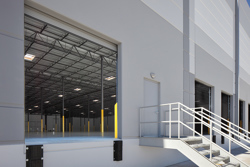 exterior view of an open dock door in the warehouse of an industrial building