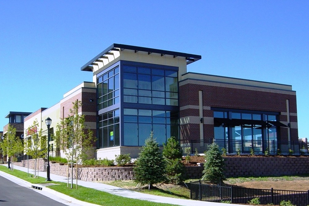 exterior of a retail building with landscaping in the foreground