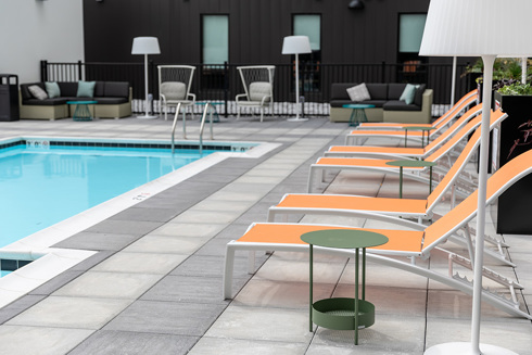 amenity outdoor patio pool deck of Seven07 U of I Student Living Development in Illinois