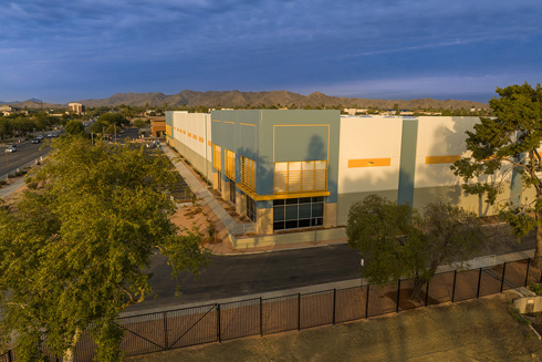 aerial view of entrance of industrial building at sunset